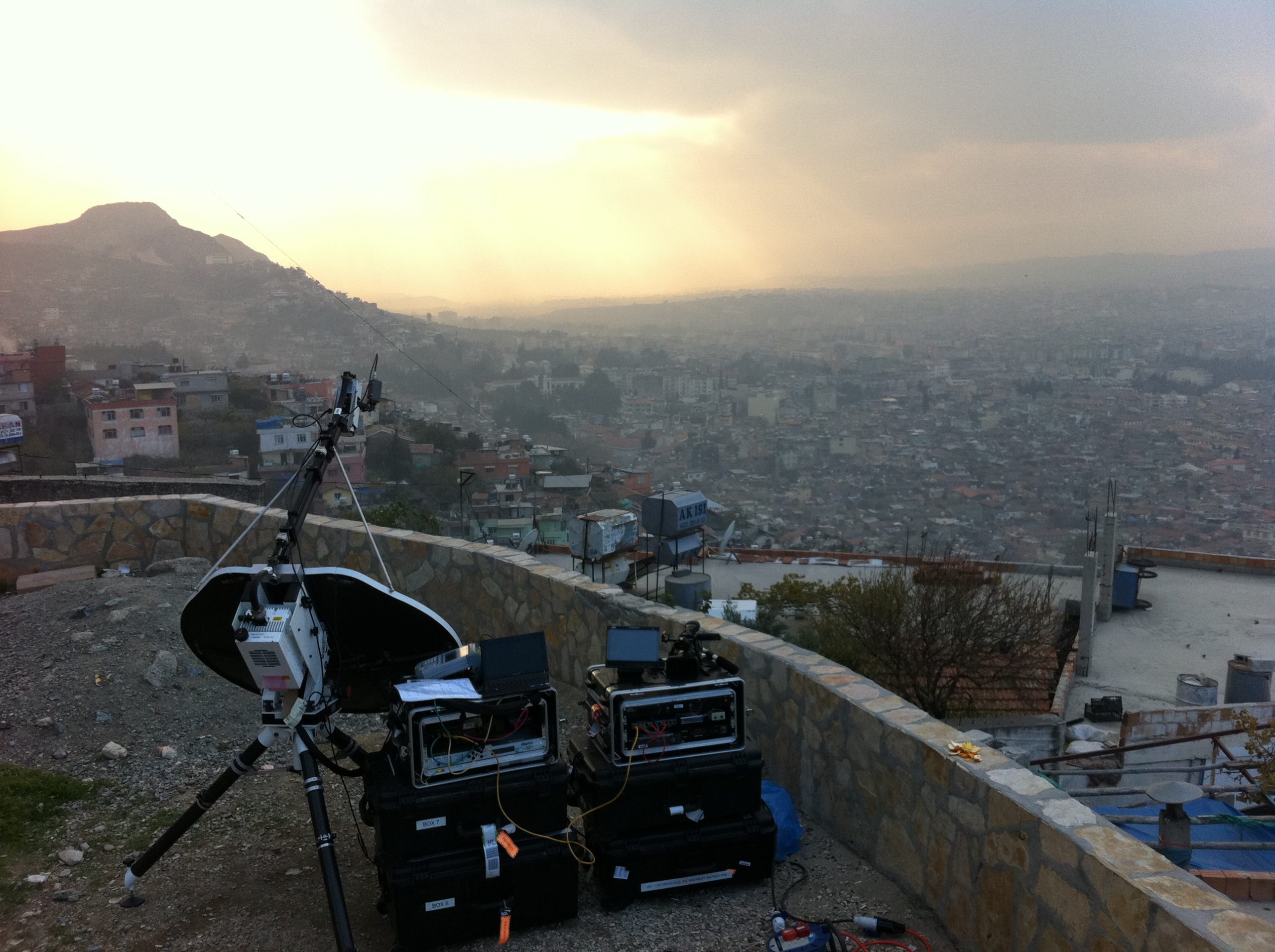 View of Holkirk flyaway terminal above city with ash-filled skyline
